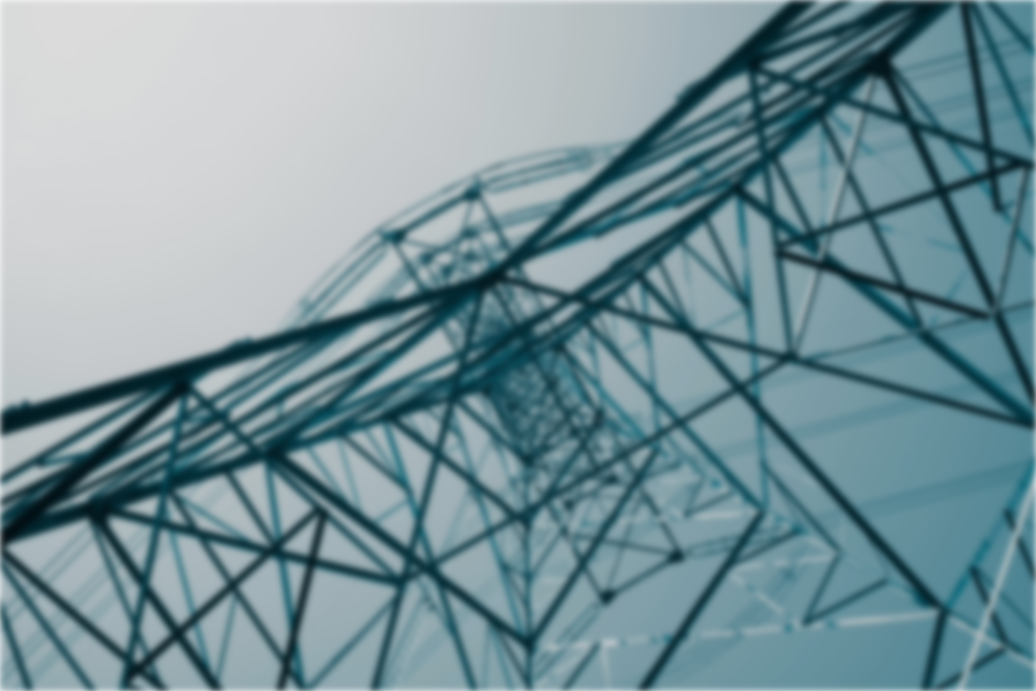 A low-angle view of a tall power transmission tower with a geometric structure against a soft gradient sky.