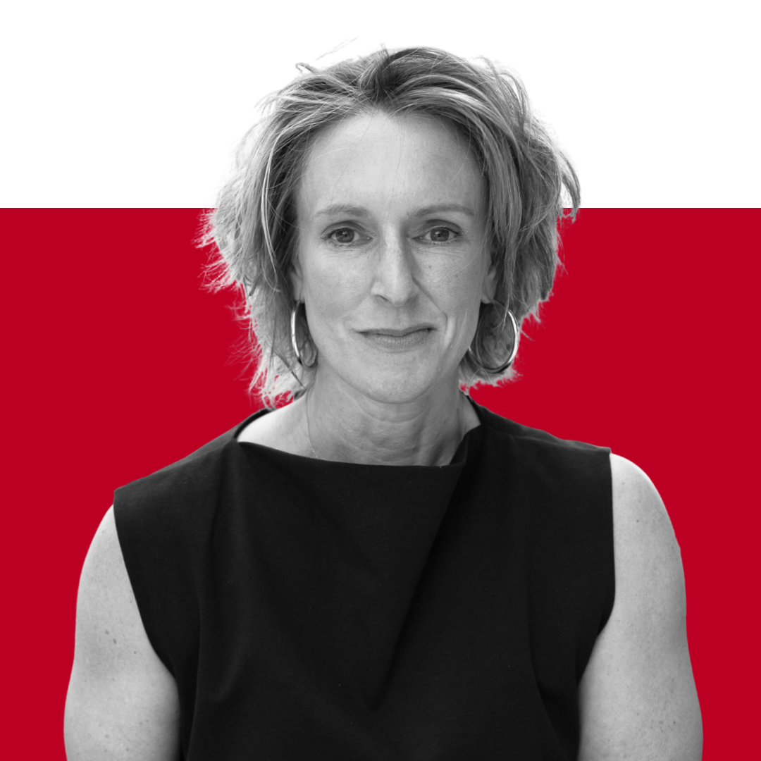 A woman with short, curly hair wearing a black sleeveless top, facing the camera with a neutral expression. The background is split with a solid red upper section.